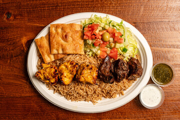 Grilled chicken and beef with rice and salad
