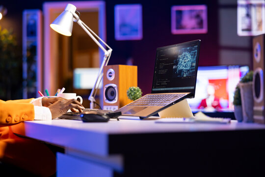 Admin using notebook in home office for artificial intelligence computing simulating human brain through self learning algorithms. Employee working with AI deep neural networks on laptop