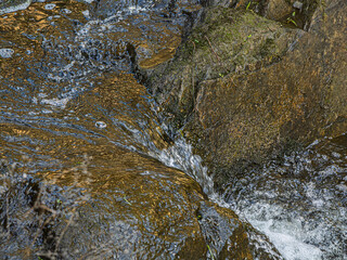  Fast Water Cascades Through Crack In Golden Rock