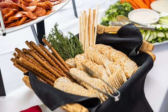 Assorted Crackers and Pretzel Rods in Elegant Black Napkin Display