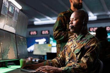 Counterintelligence agency dispatcher relays information from army intelligence analysts to front...