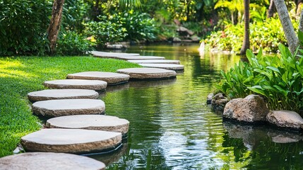 Serene stone path winding through a tranquil water garden.