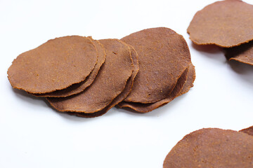 Sun-dried fermented soybean sheets called “Thua Nao,” a traditional ingredient in Northern Thai cooking.