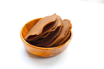 Fermented soybean discs, known as “Thua Nao,” a traditional Thai seasoning used to enhance flavor in Northern cuisine.