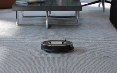 Robot cleaner on gray carpet