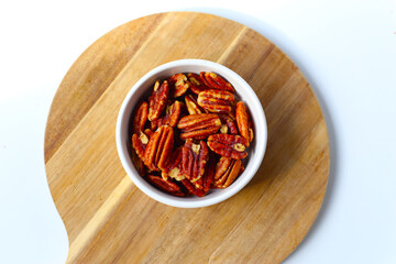 Delicious salted pecan nuts scattered.