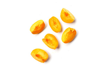 Fresh ripe apricots on a white background.