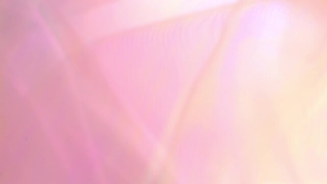 Sparkling fabric background in pink, peach and yellow pastel tones.Color transitions in pastel shade fabric. Shiny fabric wallpaper. 4k footage