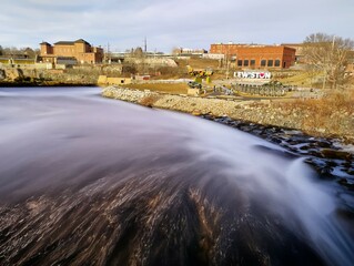 Androscoggin River, Lewisiton Auburn Maine Great Falls location.  Surrounded by historic factories, veterens park and the Lewiston sign.