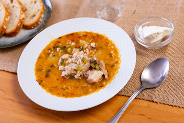 Popular dish of Russian cuisine is pickle soup with meat, cooked on basis of pickled cucumbers and...