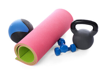 Medicine ball, dumbbells, kettlebell and fitness mat isolated on white