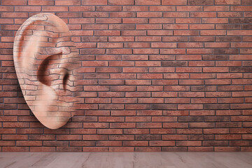 Human ear in brick wall, space for text. Eavesdropping, concept that even walls have ears