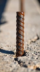 Rusty Reinforced Steel Bar Protruding From Concrete Showing Texture and Weathering