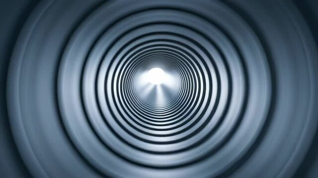 Light shining through circular metallic air duct tunnel with spiral design used engineering and industry for ventilation and air flow control systems