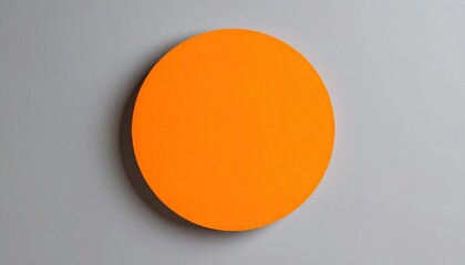 Sharp Orange Circle Floating Against A Minimal Gray Background