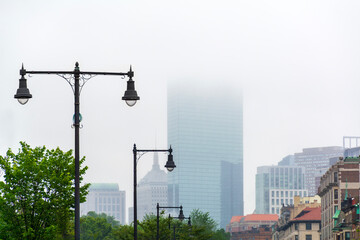 Elegant iron street lamps lining a misty urban scene in Boston, Massachusetts, USA