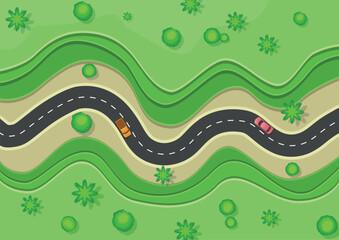 Top view of an asphalt winding two lane road passing through green fields