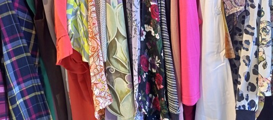 Colorful Clothes Hanging on a Rack