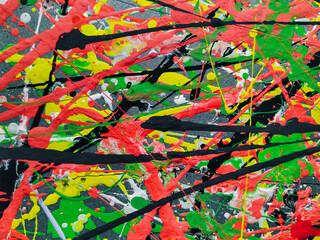 Modern abstract background made of acrylic latex paint. Green, red, yellow and black spots of...