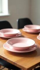 Pastel pink plates, springform pan, wooden table, white room, black chairs , baking, springform pan