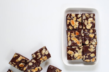 Chocolate Dessert, Homemade Chocolate Brownies with topping almond slice on plate. on white...