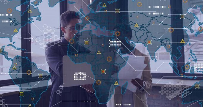 Man opening laptop toward woman while world map overlay animating data nodes for business analysis