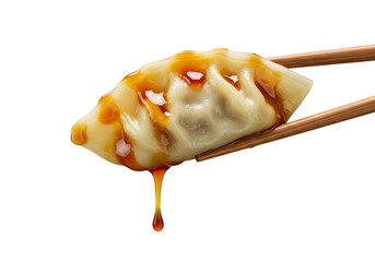 Isolated PNG Appetizing Gyoza Brown Sauce Hold in Chopsticks Cuisine