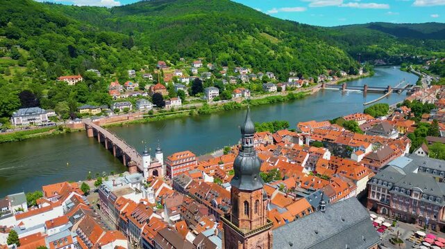 4K Aerial Drone Video of the Beautiful Heiliggeistkirche Church and Old Bridge over the Neckar River in Heidelberg, Germany
