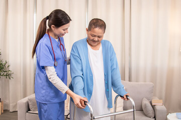Obraz premium Young nurse assisting senior woman in walking with a walker, demonstrating caregiving, encouragement, and physical rehabilitation at home, healthcare, caregiver, medical, hospitality, recover.