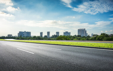 A Scenic Urban Landscape Featuring Open Road and City Skyline