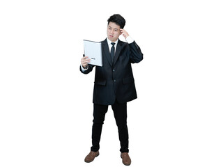 Young Asian businessman in a black suit, holding a notebook standing with a neutral or serious...