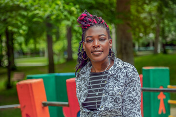 Black Woman Relaxing on Colorful Park Bench Outdoor Lifestyle