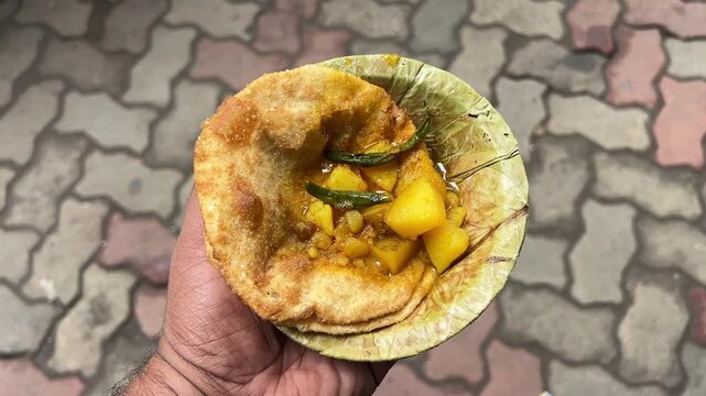 Dal puri and sabji served in sal leaves plate in the streets of Kolkata