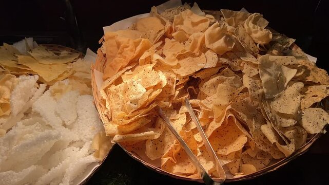 Different kinds of papad like sabudana, alu served in a wedding in India