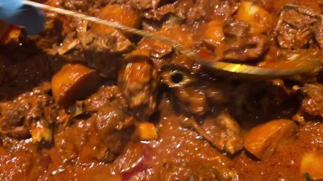 Bengali style spicy mutton curry served in Indian wedding
