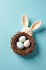 A whimsical bunny peeking from a bird's nest filled with pastel eggs against a light blue background.