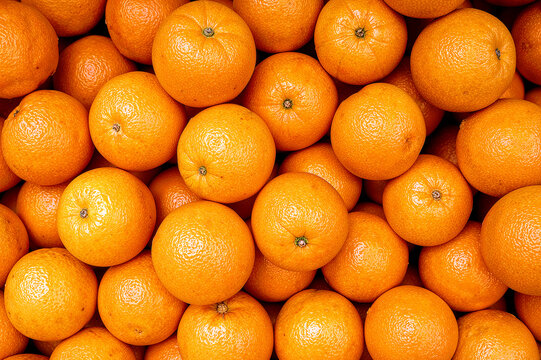 Vibrant pile of fresh tangerines ready to enjoy