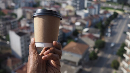 Enjoying coffee with a city view from above