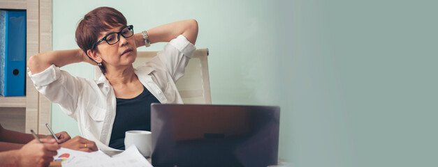Banner Woman typing laptop computer online meeting at home office work from home. Asian...