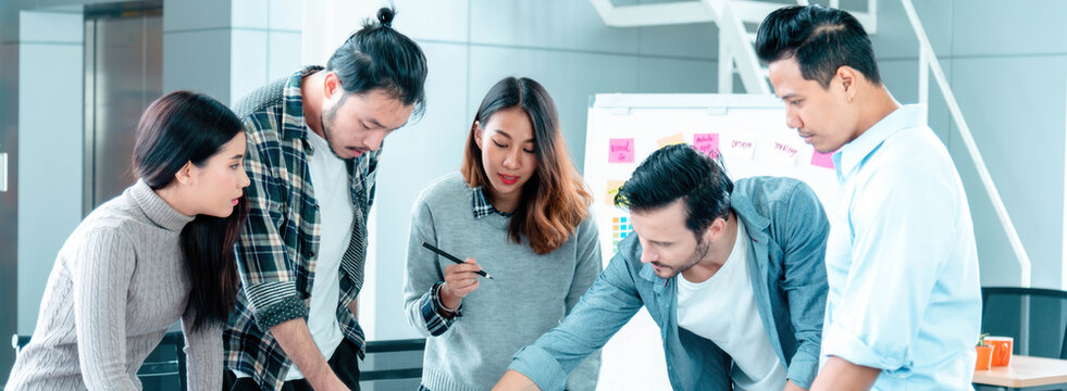 Banner diversity business people brainstorming meeting in conference room. Panorama multiracial businesspeople meeting discuss team partner. Happy asian caucasian team in meeting room with copy space