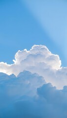 fluffy cloud against a bright blue sky.