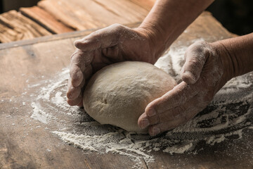 Elderly Hands Kneading Dough for Homemade Bread