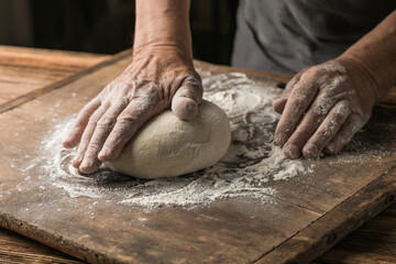 Elderly Hands Kneading Dough for Homemade Bread