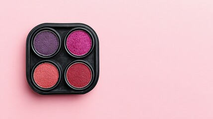 Makeup eyeshadow palette with various shades of pink and purple.