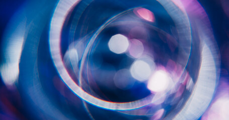 Radiant light. Bokeh ray. Defocused purple blue colorful sparkling round neon lens flare moving on...