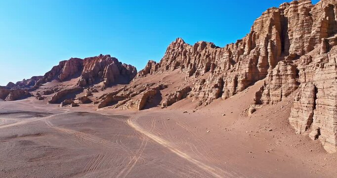 Aerial view of the yardang landform mountain in desert. Famous Dahaidao no man's land natural landscape in Xinjiang, China.
