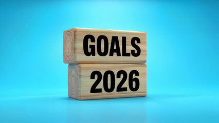 Wooden blocks stacked with the word goals on the top and the year 2026 on the bottom against a bright blue background
