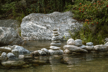 close-up of a pyramid-shaped rock pile in a stream