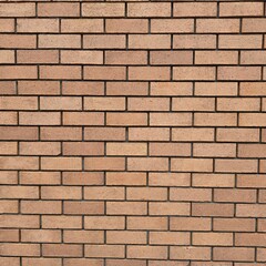 Horizontal brown brick wall texture with natural tones and aligned pattern.