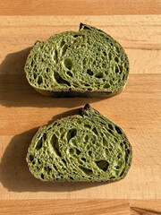 Two vibrant green slices of matcha bread.
